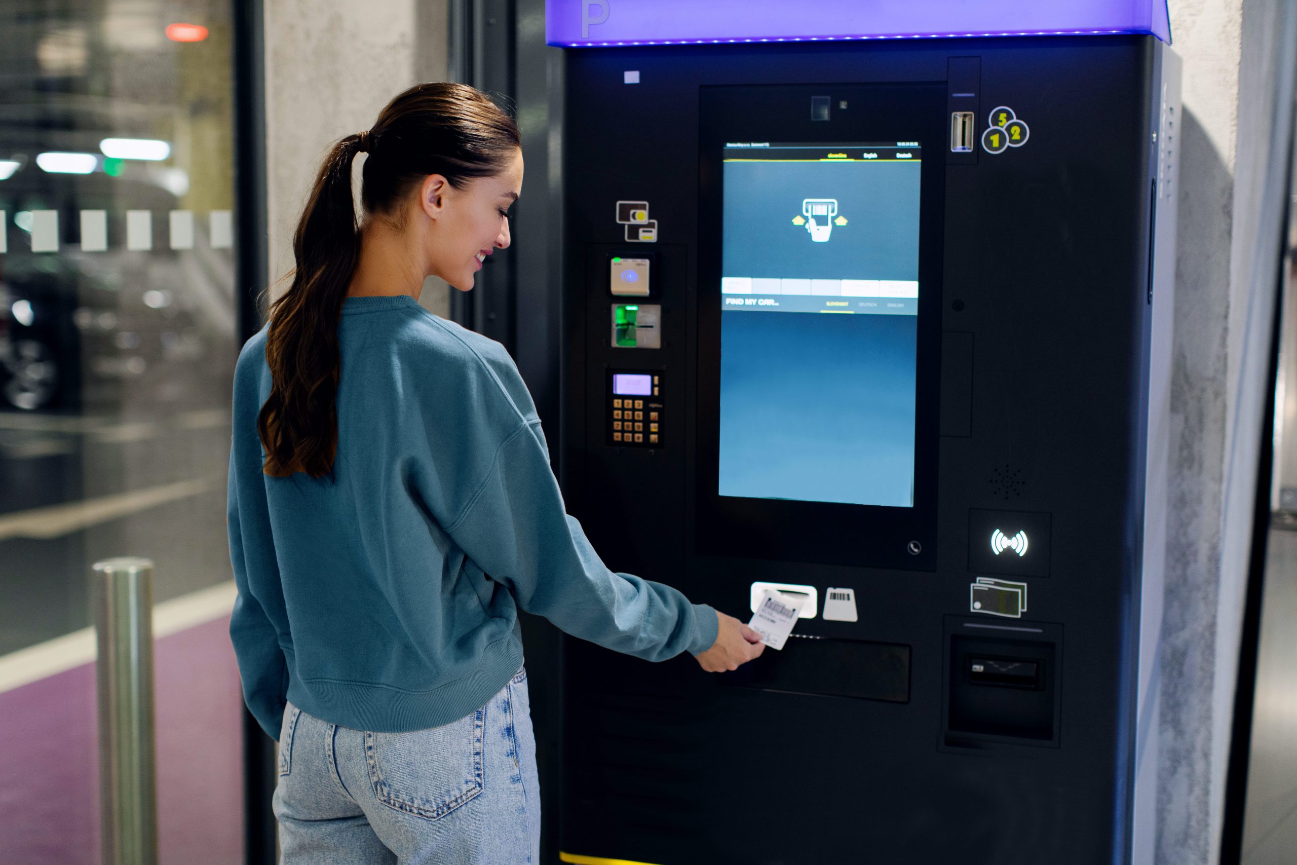 lady-driver-paying-taking-ticket-parking-meter-near-terminal-underground-parking-area (1)